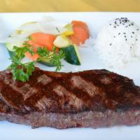 Beef Teriyaki · Grilled Black Angus New York steak, served with sautéed vegetables & rice.