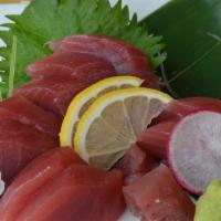 Tuna Sashimi · Fresh tuna with daikon radish, shiso leaf,  spring mix salad, & rice.