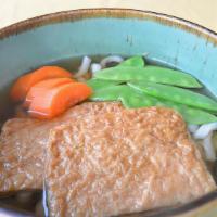 Kitsune Soba · Soba noodles and broth with sweet tofu pouch and vegetables.