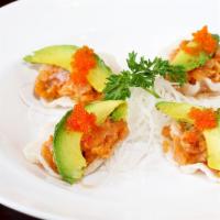 Hamachi Tartare · Yellowtail with onions and avocado, on shrimp chips (four pieces).