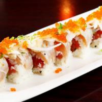 Family Affair Roll · Maguro, avocado and onions wrapped with soybean paper with albacore and creamy sauce and tob...