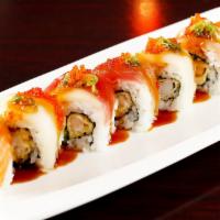 Rainbow Roll · Shrimp tempura and cucumber, topped with assorted fish and tobiko.