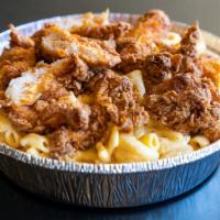 Homemade Mac N' Cheese Topped with Fried Chicken · Mac n' cheese made from scratch, topped with our spicy fried chicken. Ask for our chili and ...