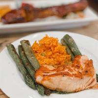Grilled Salmon · Served with cilantro chimichurri, Yucatan rice, and grilled seasonal vegetables.