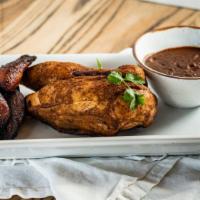 1/2 Roasted Organic Chicken Mole · House made mole poblano and fried plantains.