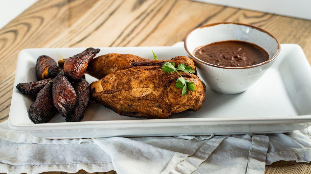 1/2 Roasted Organic Chicken Mole · House made mole poblano and fried plantains.