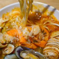 Tom Yum Noodles Soup · Rice Noodles w/ Tom Yum Soup, Broccoli,
Onion, Mushroom & Cabbage
