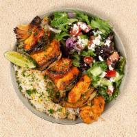 Chicken Kabob Plate · Served with seasoned rice and a salad of mixed greens, tomatoes, and cucumber.