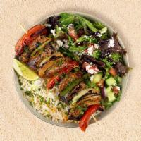 Lamb Kabob Plate · Served with seasoned rice and a salad of mixed greens, tomatoes, and cucumber.