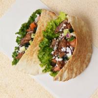 Beef & Chicken Gyro Pita Sandwich · Wrapped in a pita with lettuce, cucumber, tomato, and your choice of sauce.