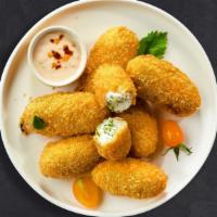 Oh-So-Good Fried Jalapenos · Feeling cooped up? Try a hot favorite! Fresh jalapenos and creamy cheese wrapped in batter a...
