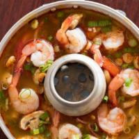 12. Tom Yum · Spicy. Hot sour soup with fresh mushroom, tomatoes, onions, lemongrass, kaffir lime leaves, ...