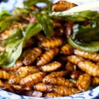 Fried Silkworms · Famous side street food in Thailand. Fried silk worms with seasoning and soy sauce.