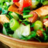Fattoush Salad · feta cheese,romaine lettuce,cucumber,tomato,black olive,corriander,green onion & pita chips ...