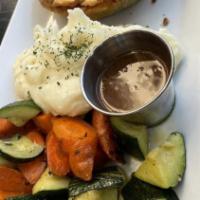 Shepherds Pie · Ground beef with root vegetables in a rich gravy, topped with creamy mash, and side of veggi...
