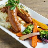 Sausage & Colcannon · Mashed potatoes with braised leeks, kale and onion served with succulent Irish sausages and ...