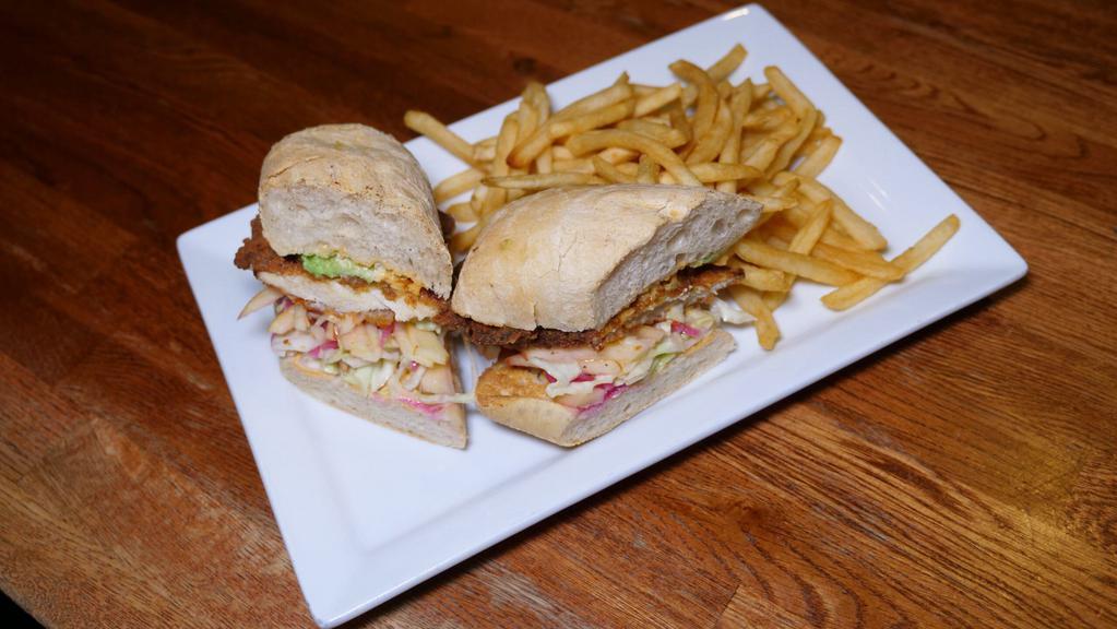 Almond Crispy Chicken Sandwich · Apple slaw, red pickled onion, avocado, chipotle aioli and shoestring fries.