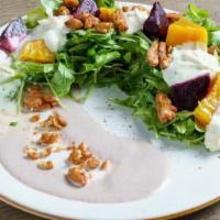 Roast Beets Salad · Wild arugula, orange, shaved carrots, parsnip, feta cheese, pistachios and citrus vinaigrette.