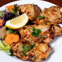 Cream Pepper Chicken Kabab · Boneless chicken in cream, chili, pepper, herbs, and spices and baked in tandor.
