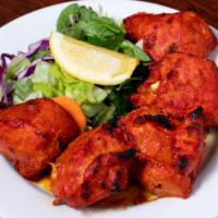 Chicken Tikka Kabab · Boneless chicken pieces marinated in yogurt, herbs and spices and baked in tandoor.