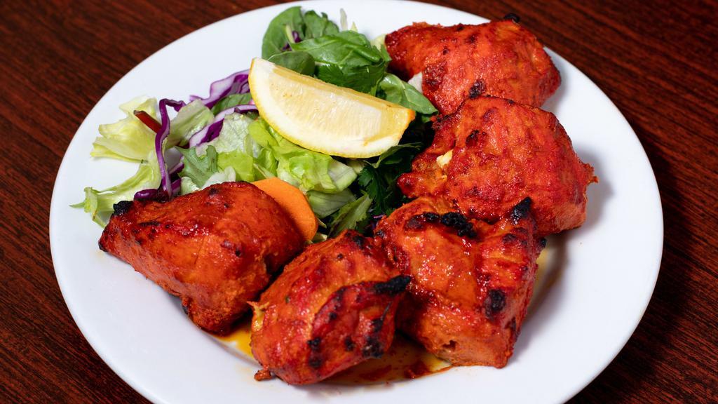 Chicken Tikka Kabab · Boneless chicken pieces marinated in yogurt, herbs and spices and baked in tandoor.