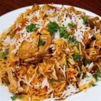 Chicken Biryani · Basmati fried rice with chicken, herbs and spices.