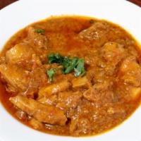 Chicken Karahi · Chicken sautéed with tomatoes, bell pepper and spices in a traditional pan.