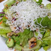 Asian Chicken Salad · Rice noodles, cabbage, red onions, cucumbers, shredded carrots, cilantro, and peanuts tossed...