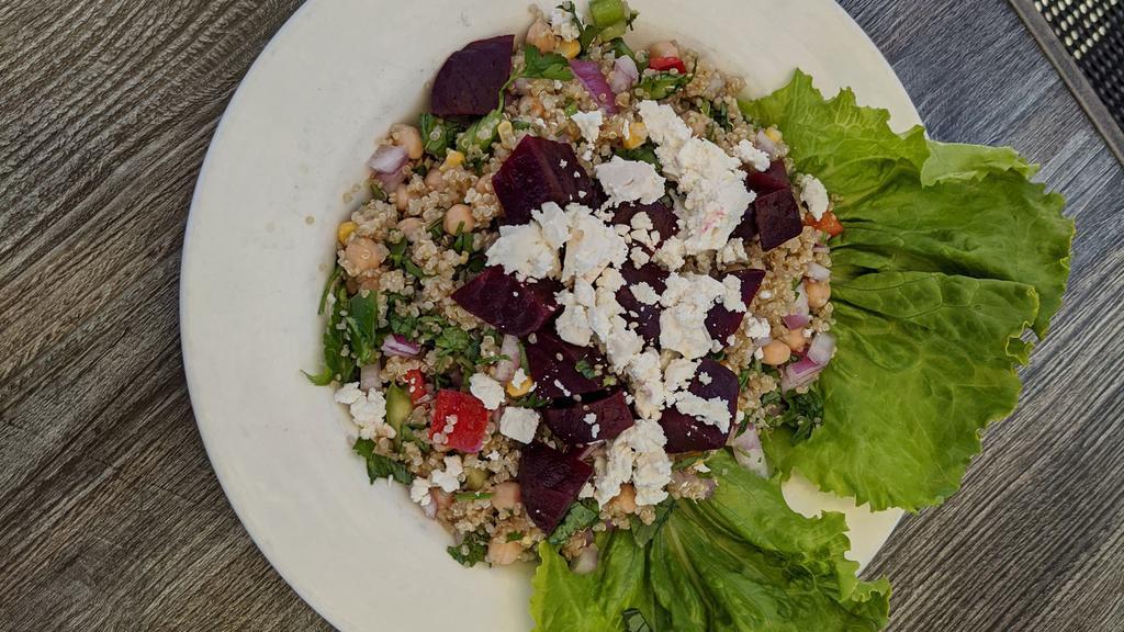 Quinoa Salad · Quinoa, beets, garbanzo beans, corn, red onions, basil, parsley, bell pepper and feta cheese with olive oil and lemon dressing.
