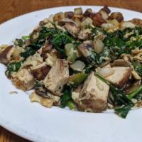Tofu · Marinated grilled organic tofu with mushrooms, spinach, onions, and bell peppers.