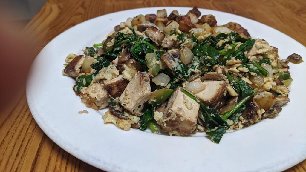 Tofu · Marinated grilled organic tofu with mushrooms, spinach, onions, and bell peppers.