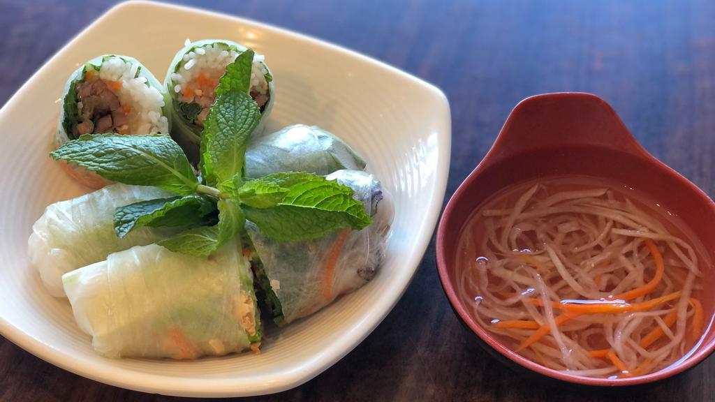 4. BBQ Pork Roll · *Contains Peanuts.* Hand rolled w/ flame grilled BBQ pork, peanuts, mint leaves, carrots, daikon, vermicelli served w/ homemade fish sauce on the side