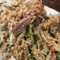 2. Chicken Salad with Cabbage · *Contains Peanuts.* Shredded chicken, carrots, daikon, cucumber, onions, cilantro, fried sha...