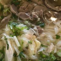 08. Chicken Meat & Giblets Noodle Soup · Shredded chicken w/ chicken liver & gizzard in chicken broth topped w/ onions, cilantro, & s...
