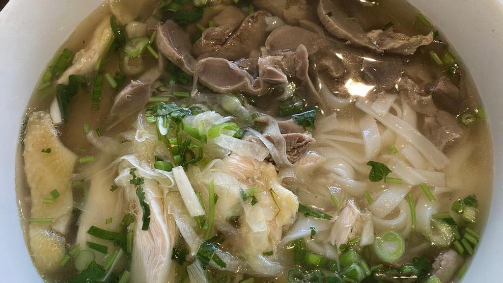 08. Chicken Meat & Giblets Noodle Soup · Shredded chicken w/ chicken liver & gizzard in chicken broth topped w/ onions, cilantro, & scallion served with flat rice noodles