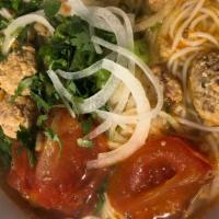13. Crab Meat & Tomato with Vermicelli Noodle · Fresh tomatoes, crab & pork paste in a tomato based chicken broth served w/ cabbage and shri...