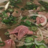 10. Well-Done Beef, Rare Beef Noodle Soup (Filet Mignon) · Well done sliced flank steak & flat rice noodles served in beef broth topped w/ sliced rare ...