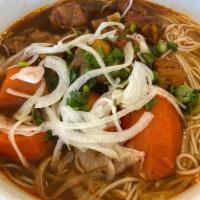 17. Wine Sauce Ox Tail Noodle Soup · Oxtail and carrots w/ homemade wine sauce mixed in beef broth topped with onions, cilantro, ...