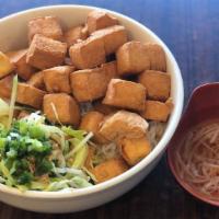 35. Fried Tofu with Vermicelli · *Contains Peanuts.* Deep fried tofu cubes topped w/ peanuts, scallion, lettuce & shredded cu...