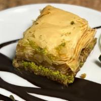 Baklava · Sweet dessert pastry made of layers of filo filled with chopped nuts and sweetened and held ...