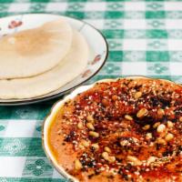 Muhammara · Roasted pepper spread with walnuts, almonds, pomegranate molasses, and spices.