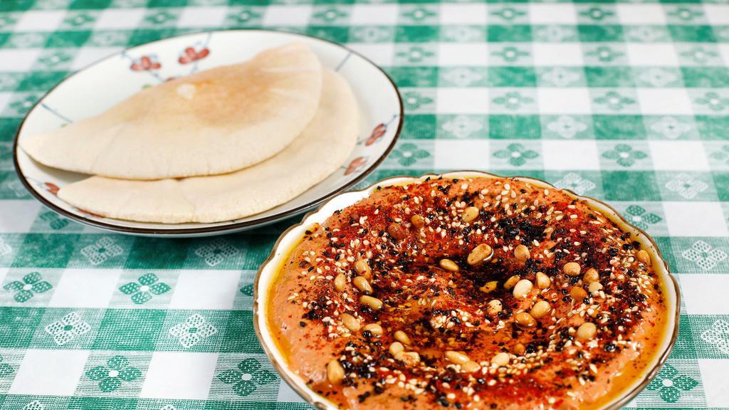 Muhammara · Roasted pepper spread with walnuts, almonds, pomegranate molasses, and spices.