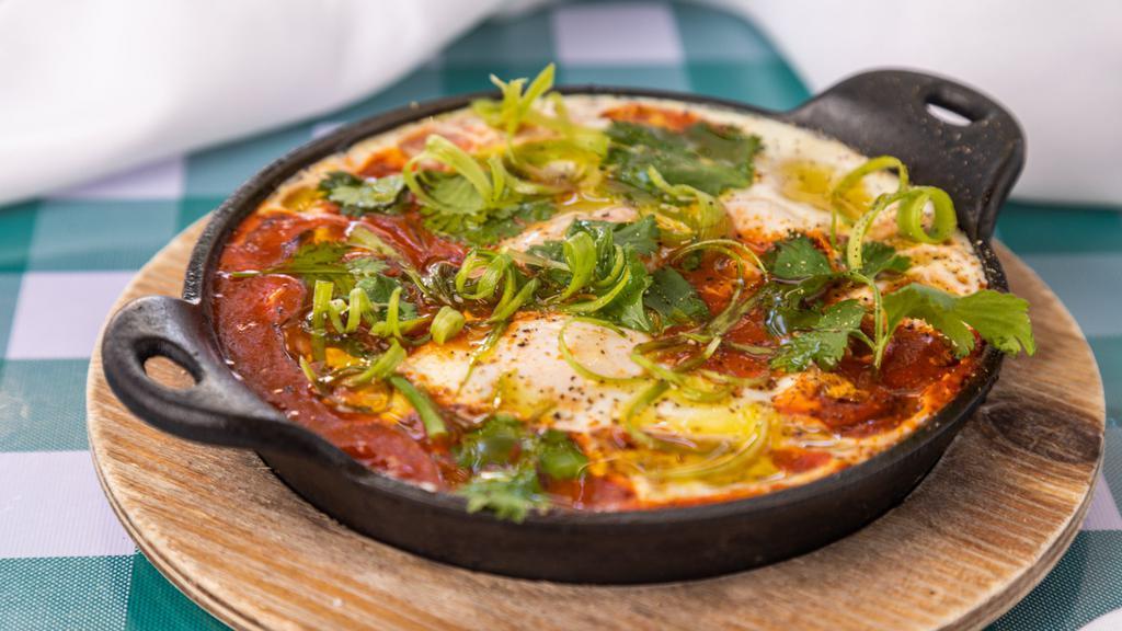 Shakshuka · Farm eggs poached in a spiced tomato and pepper stew.