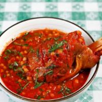 Gazan Braised Lamb Shank · After 5 pm only. Garlic, peppers, tomatoes, spices, maftool (hand-rolled couscous pasta from...