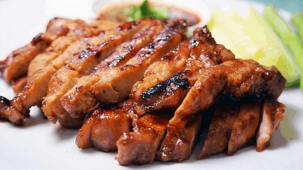 BBQ pork  · Grilled pork marinated with Thai herbs, served with house salad and sweet & sour sauce (Lunch Served with Rice)