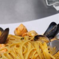 'Tutto Pesce' (Seafood Linguine) · Linguine with clams, mussels, shrimp, calamari and salmon in our fragant seafood red sauce