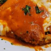 'Squisitezza' (Chicken Parmigiana) · Chicken Parmesan served over pasta marinara
