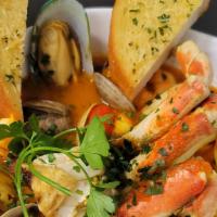 Sapore di Mare (Cioppino) · Clams, mussels, shrimp, calamari and dungeness crab legs in our delicious saffron-marinara b...