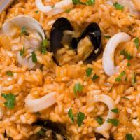 Seafood Risotto · Risotto with clams, mussels, shrimp, salmon and calamari in our delicious seafood red sauce