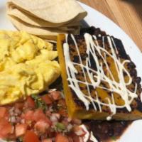 Desayuno Tipico · 2 eggs any style with grilled plantain and topped with tamarind sour cream.